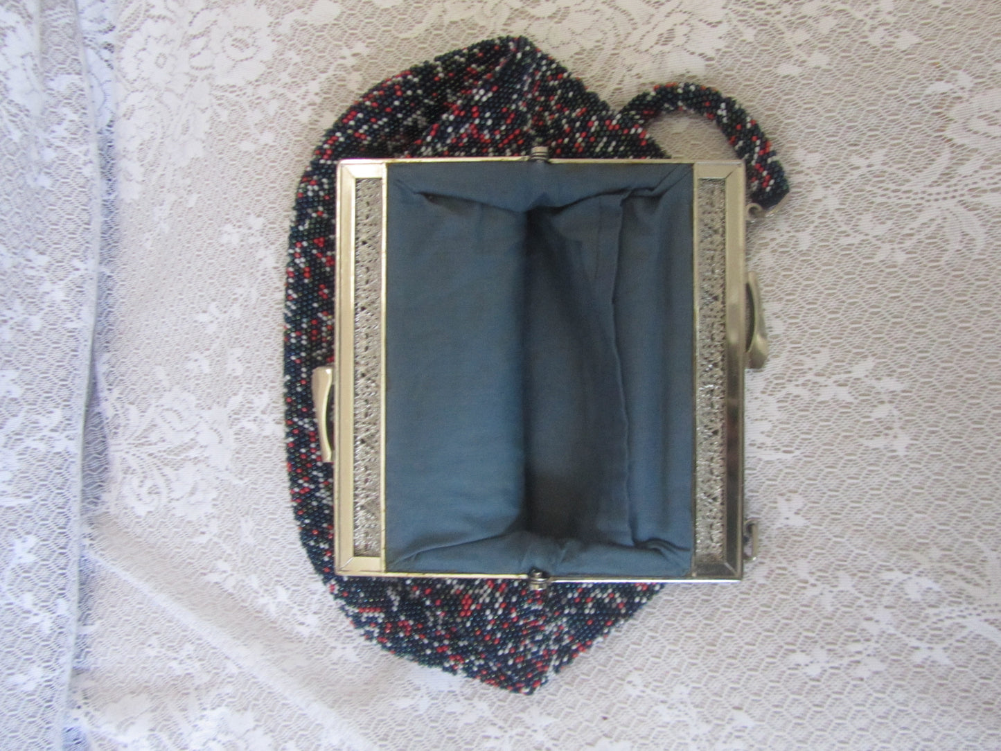 Handbag with a textured strap on a textured surface