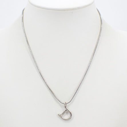 christian dior silver tone “d” logo necklace