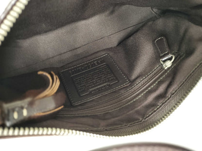 Close-up of a bag with a visible brand label on a white background