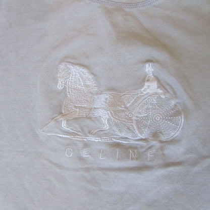 Embroidered rocking horse design on a beige fabric with 'Geline' branding.