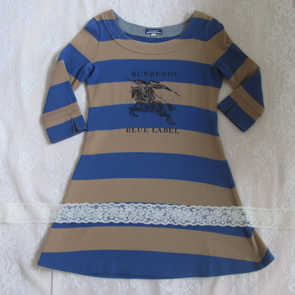 Striped dress with Burberry logo on a textured white background