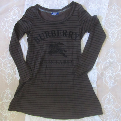 Brown striped Burberry dress on a patterned surface