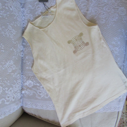 Beige baby top with a design on a lace tablecloth