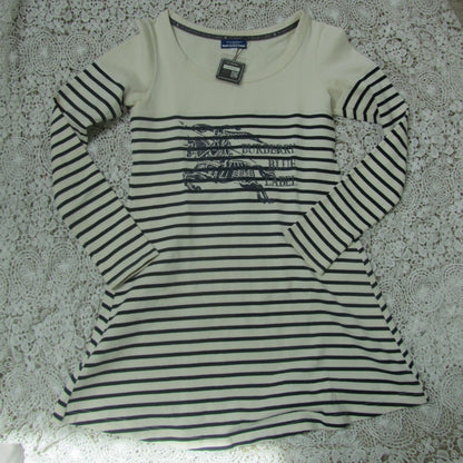 Striped long-sleeve shirt with a logo on a textured surface