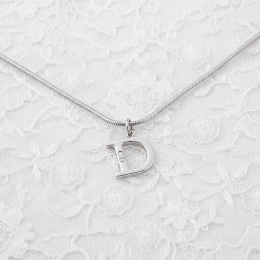 christian dior silver tone “d” logo necklace