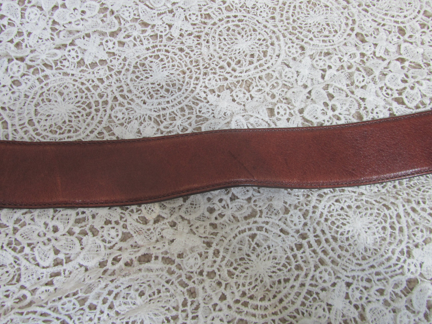 brown belt on lace background
