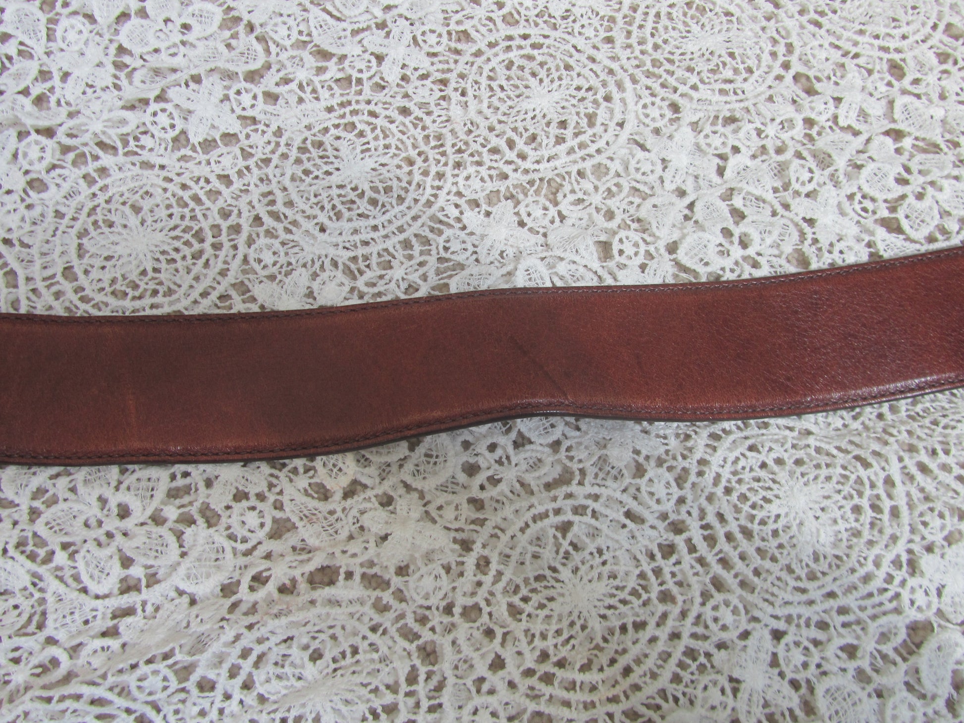 brown belt on lace background