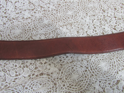 brown belt on lace background