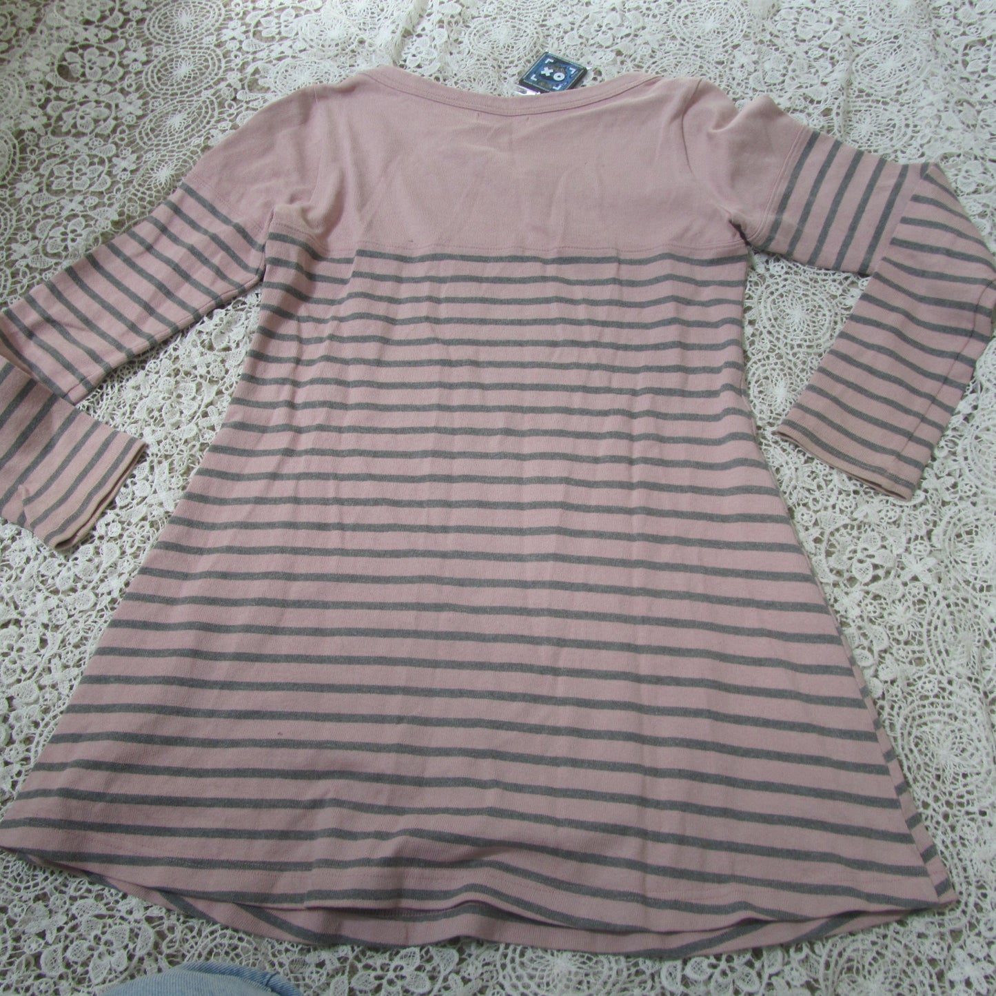 pink striped  dress on a lace background