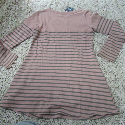 pink striped  dress on a lace background