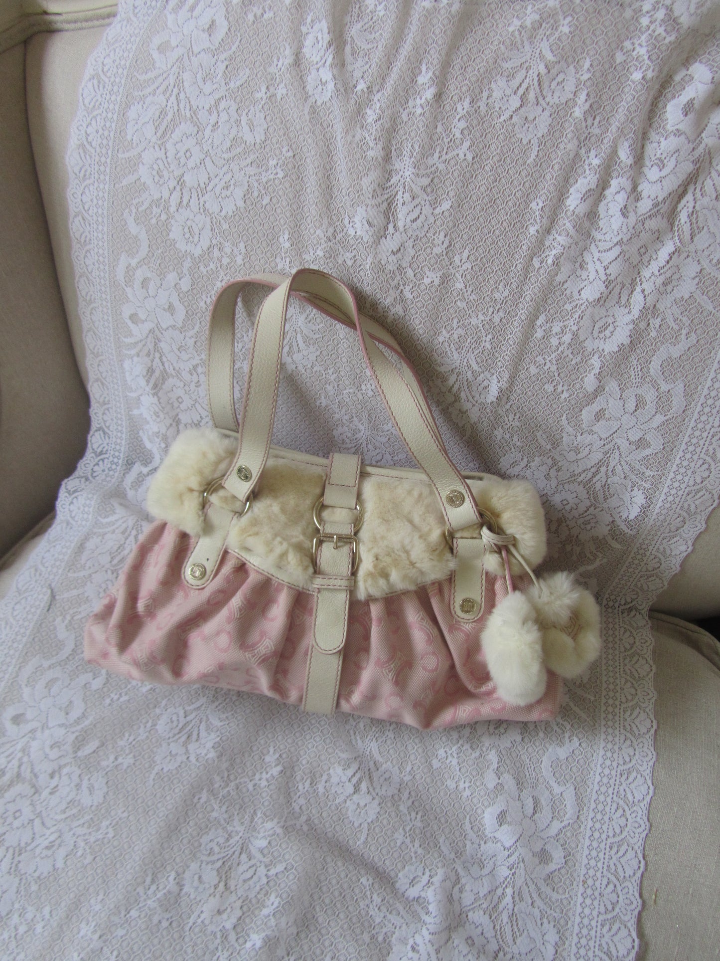 bag with fur trim on a textured surface