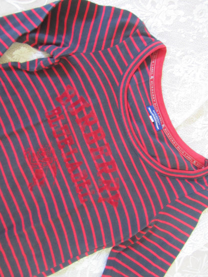 Red and gray striped shirt with text on a white background