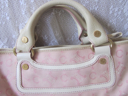 Pink patterned bag on a textured white surface