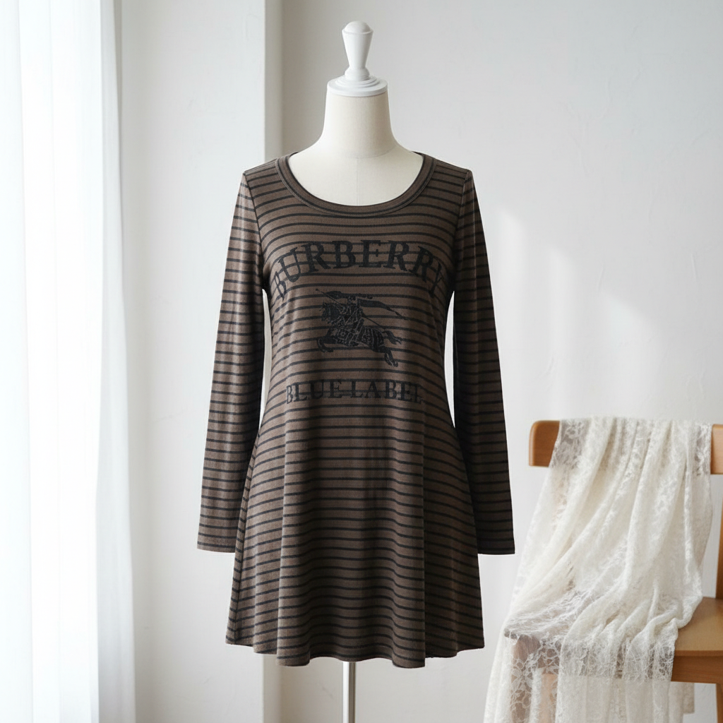 Striped dress on a mannequin against a white background