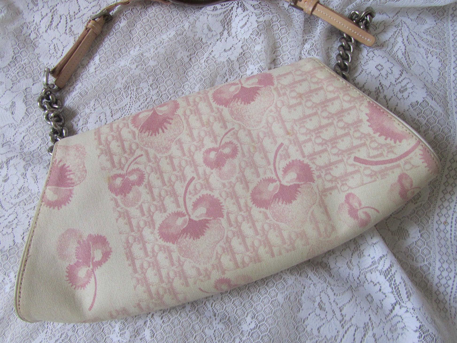 Floral patterned clutch bag on a textured surface