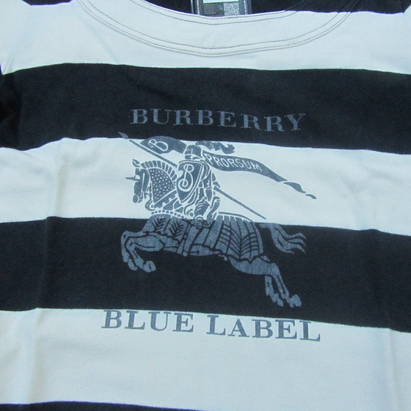 Burberry Blue Label shirt with black and white stripes on a plain background