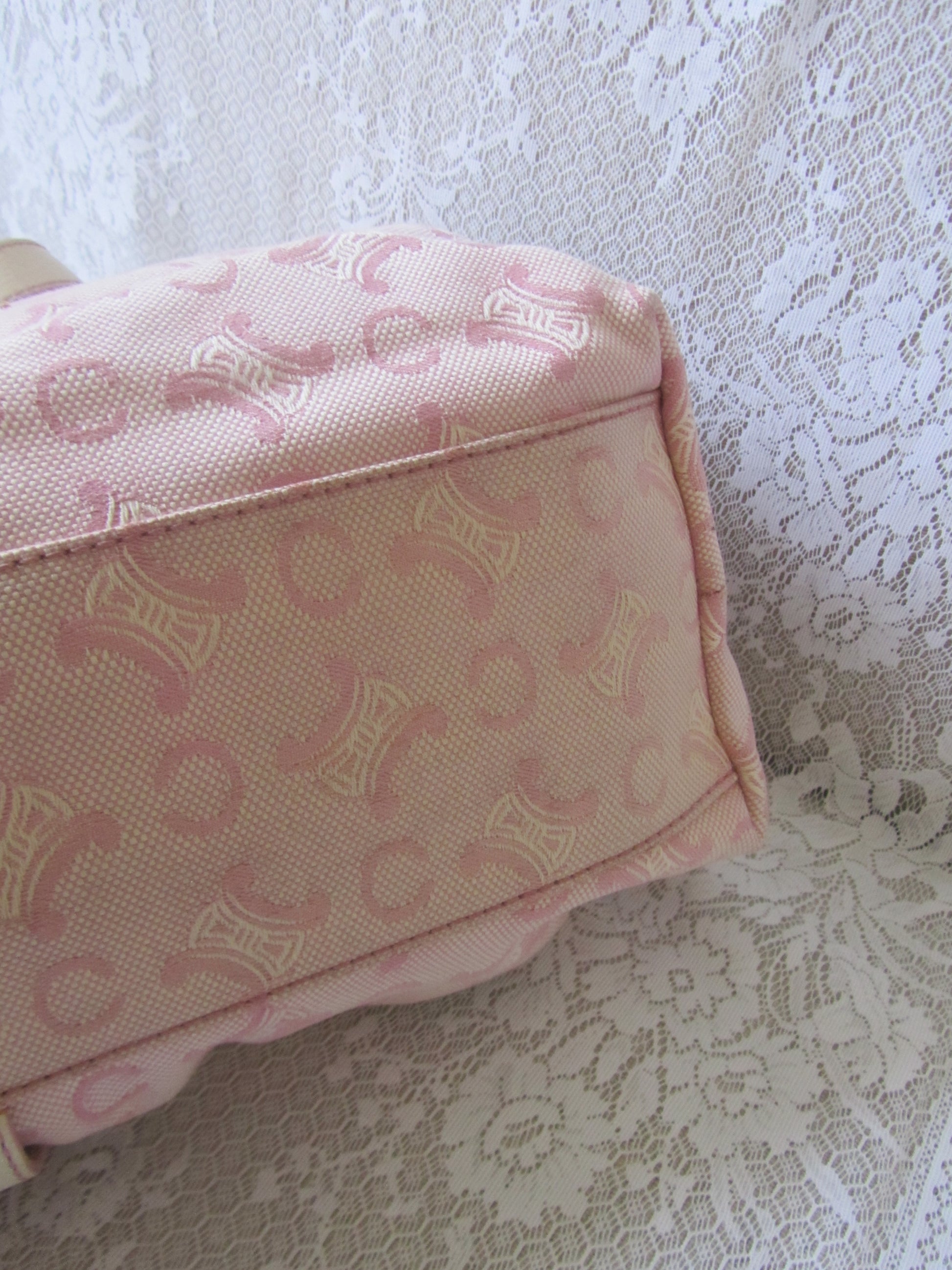 Pink pouch with a pattern on a textured surface