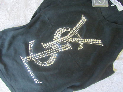 Black t-shirt with rhinestone design on a textured surface