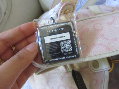 Hand holding a battery with 'LEGITAPP' branding and QR code on a patterned background