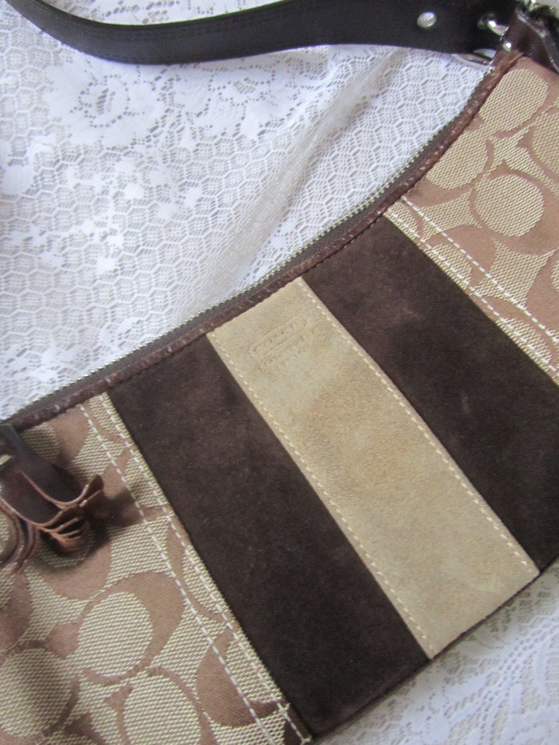 Patterned bag with brown and beige stripes on a textured white background