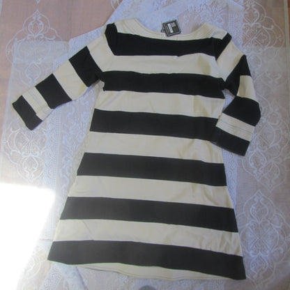Black and white striped dress on a lace tablecloth