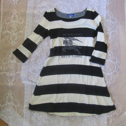 Black and white striped shirt on a lace tablecloth