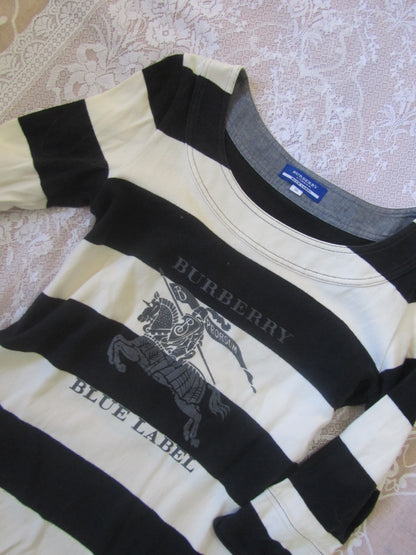 Black and white striped shirt with Burberry logo on a textured surface