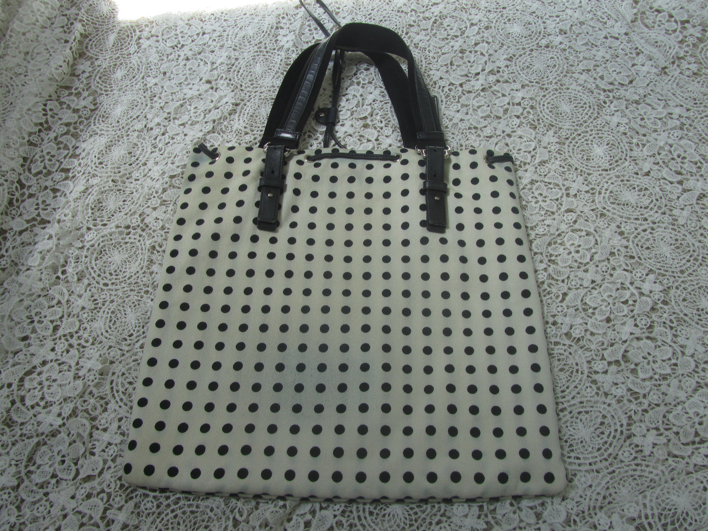  polkadot tote bag  on a lace background 