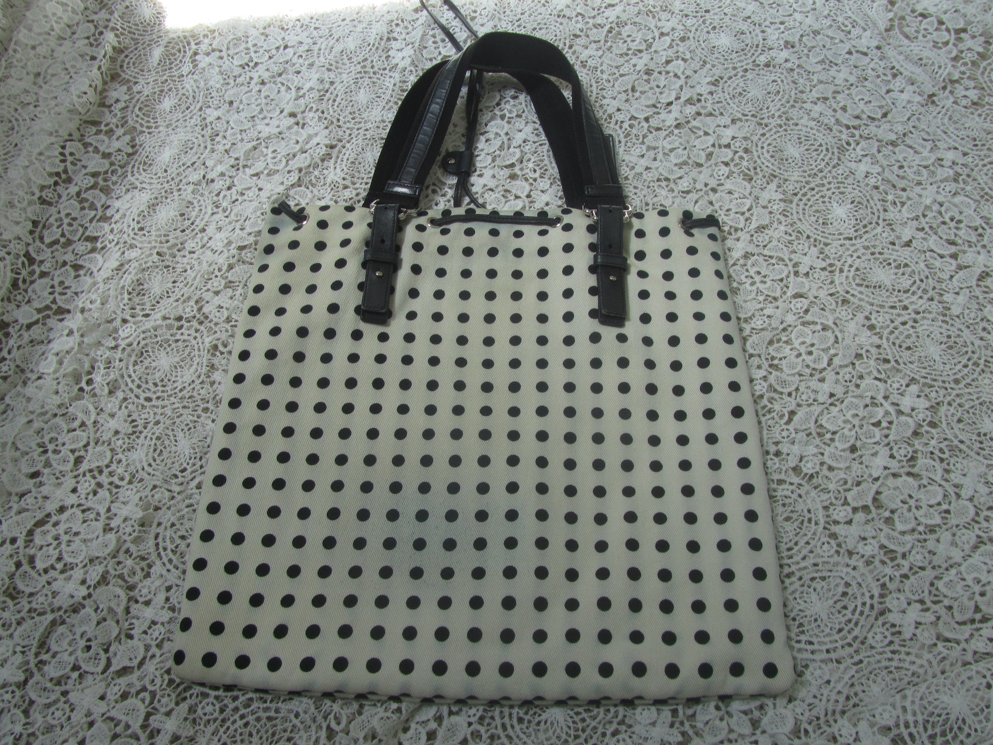  polkadot tote bag  on a lace background 