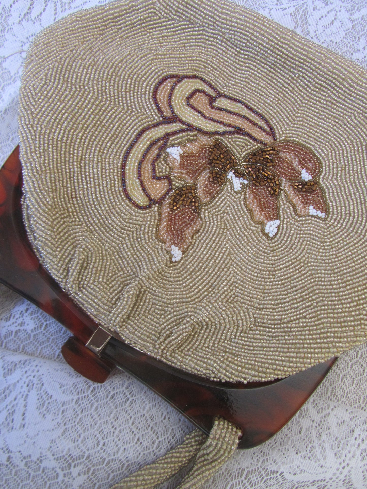 Decorative bag with floral embroidery on a textured surface