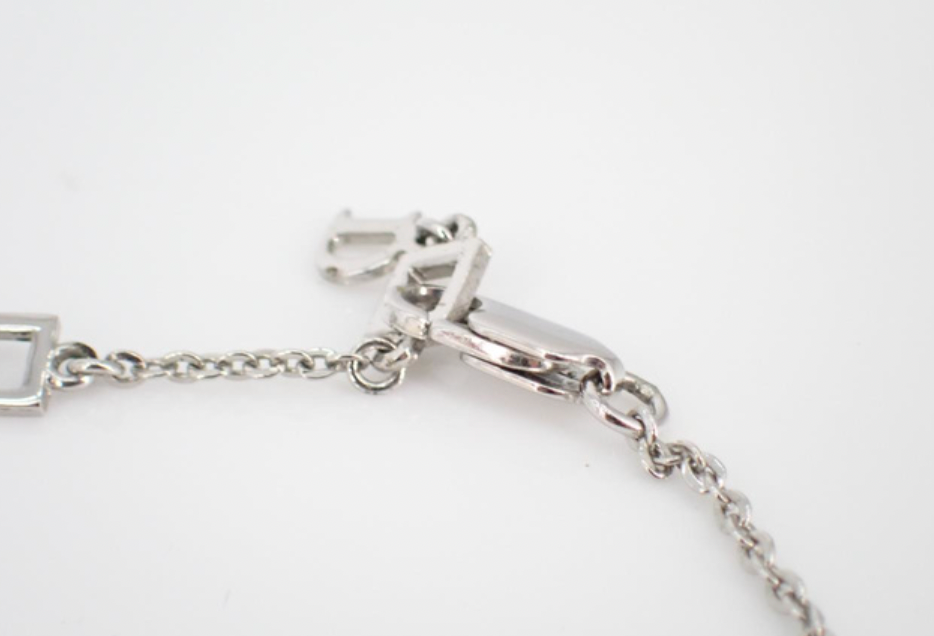 christian dior silver heart & arrow bracelet