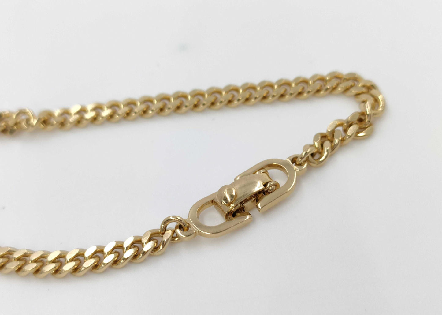 christian dior gold-tone rhinestone logo bracelet