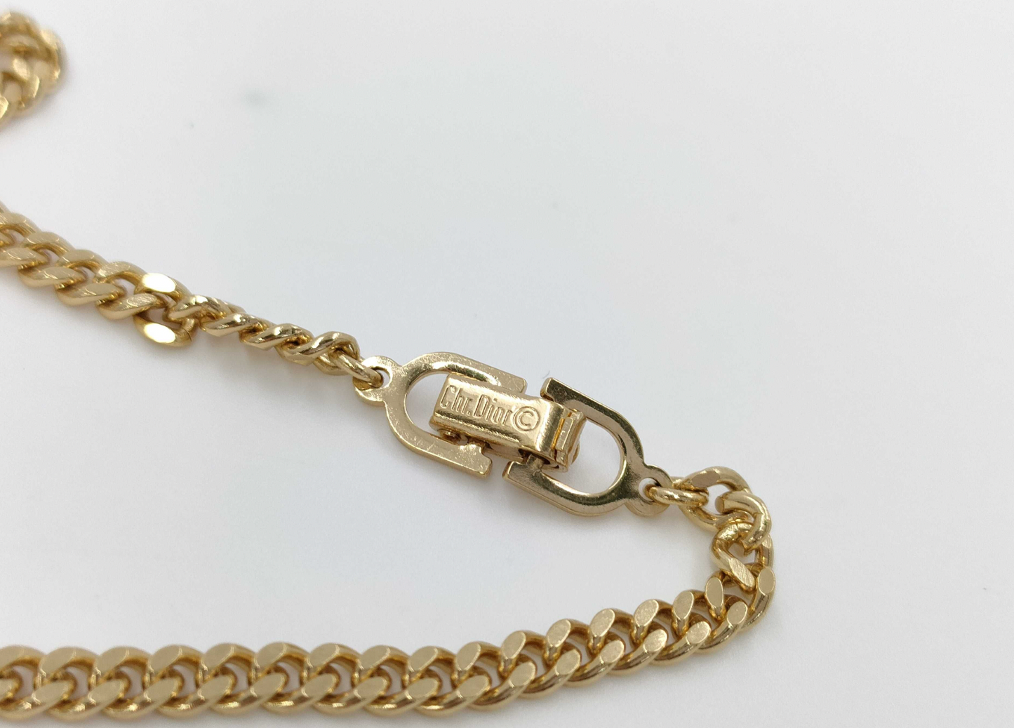 christian dior gold-tone rhinestone logo bracelet