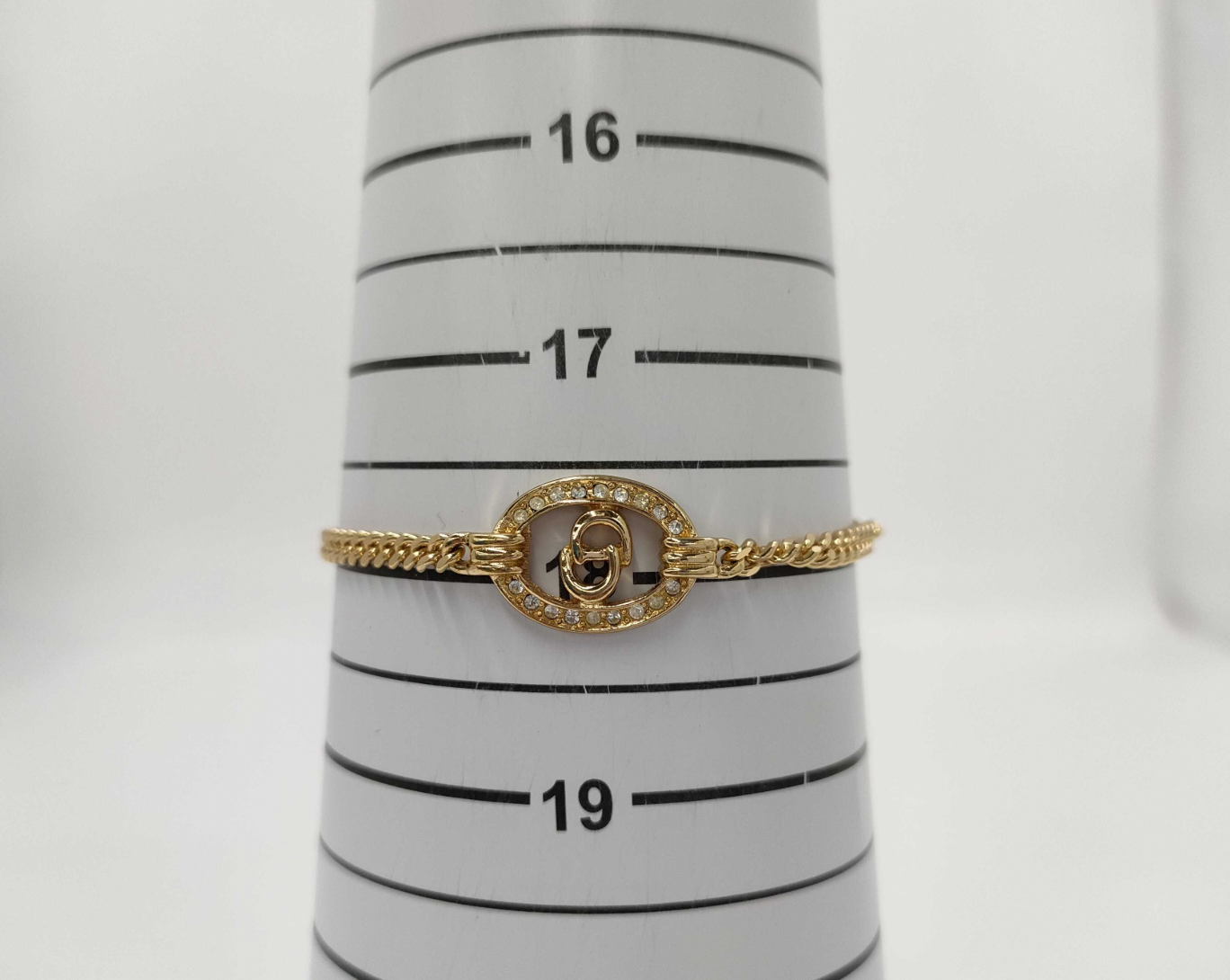 christian dior gold-tone rhinestone logo bracelet