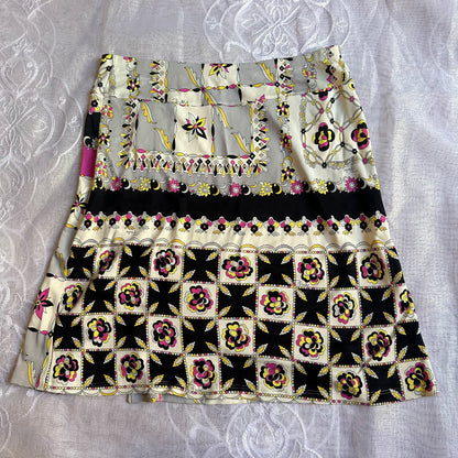 Skirt with floral and geometric pattern on a textured white background