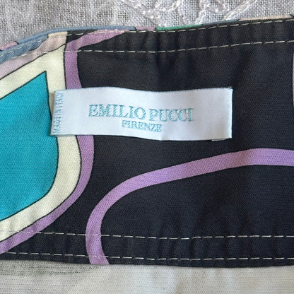 Emilio Pucci label on a piece of fabric with colorful patterns