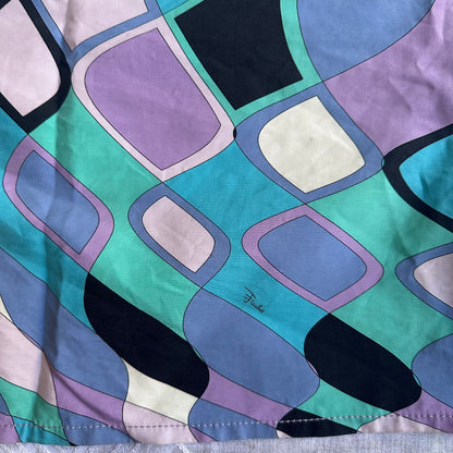 Colorful abstract patterned fabric with geometric shapes on a white background