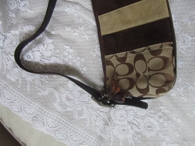 Patterned bag with brown and beige stripes on a textured white background