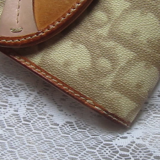 dior heart detailed wallet on a lace background