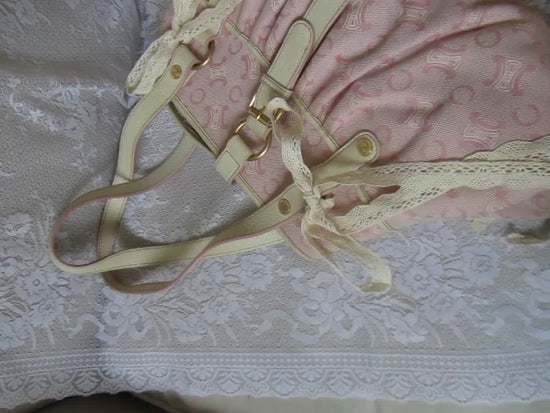 pink handbag on a lace background