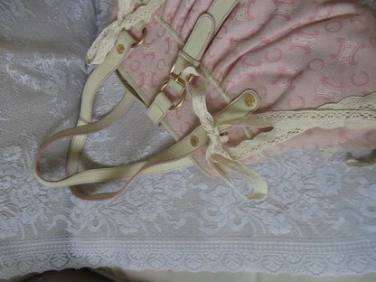 pink handbag on a lace background