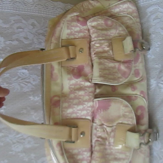pink floral handbag on a lace background