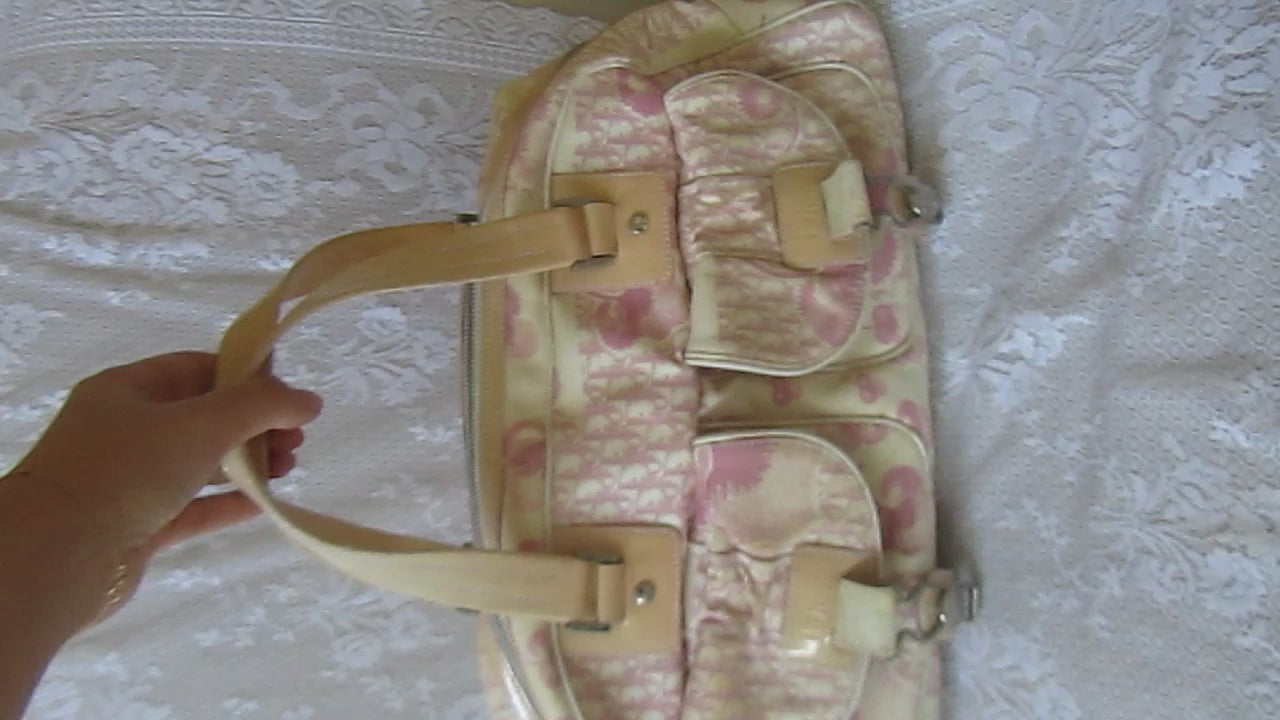 pink floral handbag on a lace background