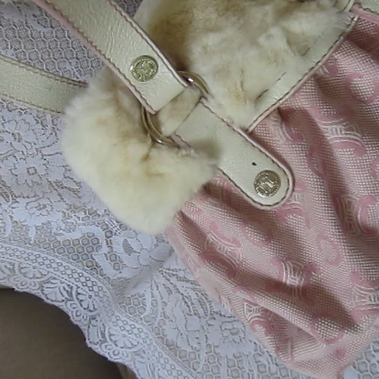 pink handbag on a lace background