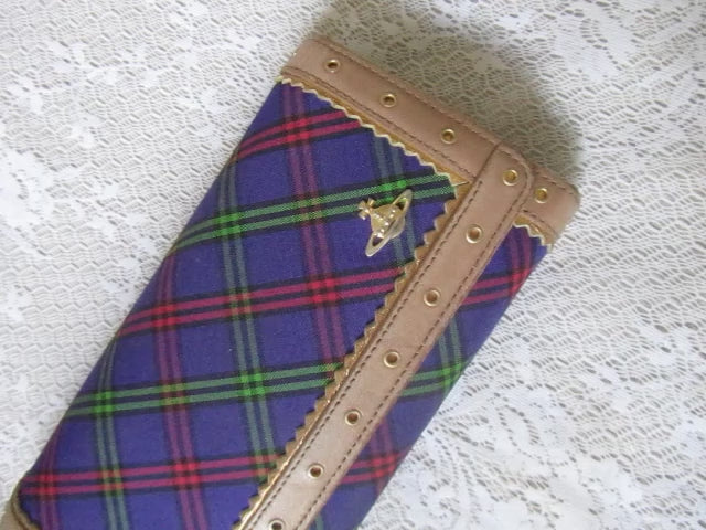 plaid wallet on a lace surface 
