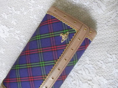 plaid wallet on a lace surface 