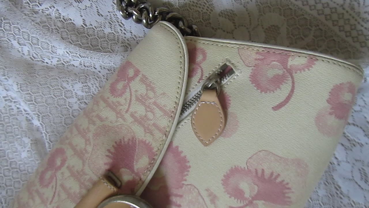 pink floral handbag on a lace background